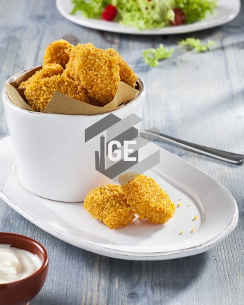 Chicken nuggets breaded in cornflakes